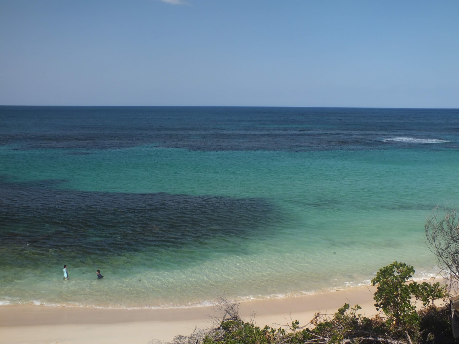 Photo de Four Mile Beach et le règlement
