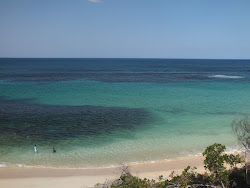 Photo de Four Mile Beach et le règlement