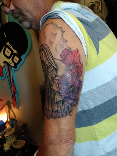 Explore front of neck tattoo ideas, creative tattoo ideas in Saint Louis, available at Enigma Tattoos & Body Piercings