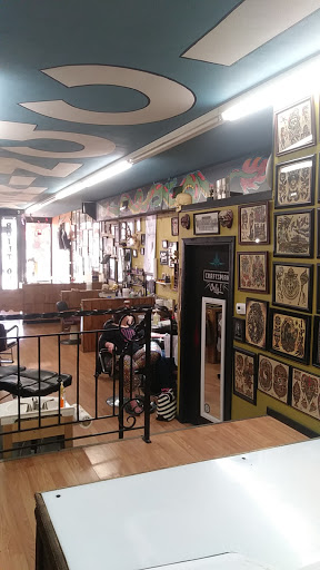 Explore pink ribbon tattoo ideas, creative tattoo ideas in Kansas City, available at Working Class Tattoo