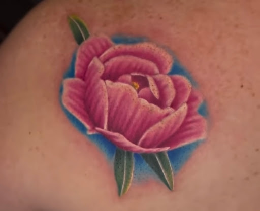 Explore butterfly flower tattoo ideas, creative tattoo ideas in Fort Wayne, available at Grade A Tattoos and Body Piercing
