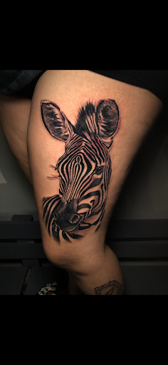Explore small thigh tattoo ideas, creative tattoo ideas in Atlanta, available at Iron Palm Tattoos & Body Piercing Atlanta