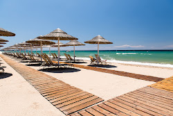 Foto di Spiaggia di Portes con costa lunga e dritta