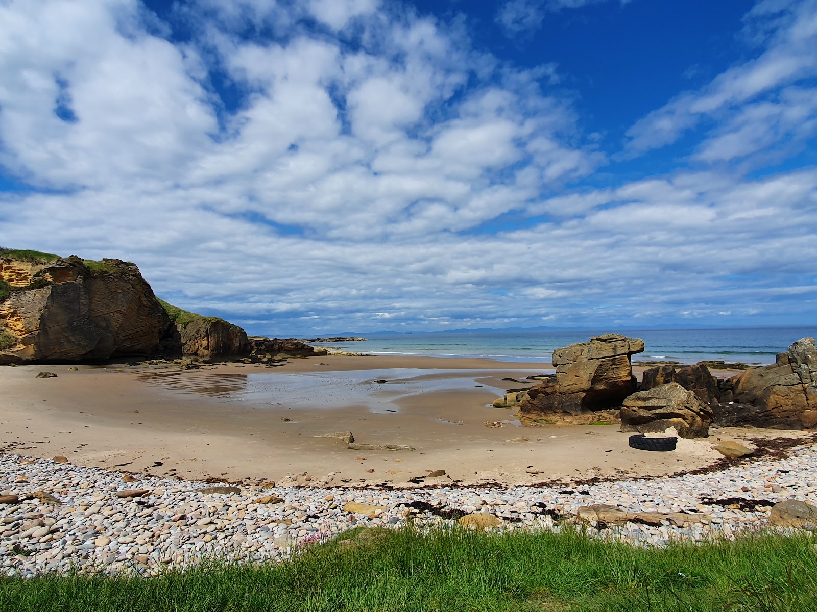 Foto av Cove Bay Beach med liten vik