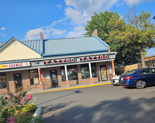 Explore neck tattoo ideas guys, creative tattoo ideas in Manassas, available at Exposed Temptations Tattoo