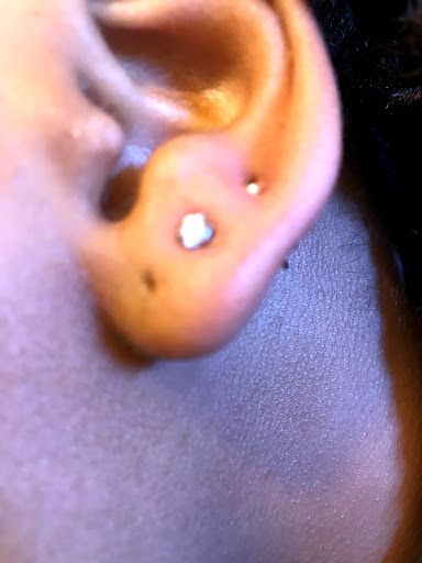 Explore outer forearm tattoos for men ideas, creative tattoo ideas in Columbia, available at Knotty Headz Tattoo Factory & Body Piercings