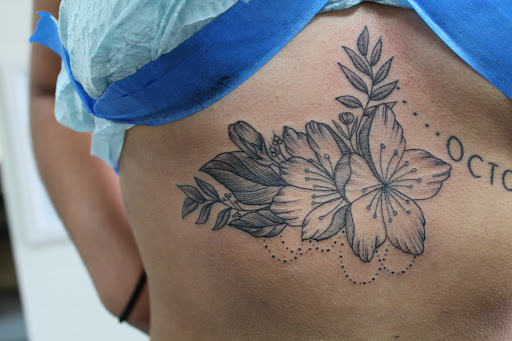 Explore black and grey half sleeve tattoo ideas, creative tattoo ideas in Fort Myers, available at Tiger Lotus Tattoo and Piercing