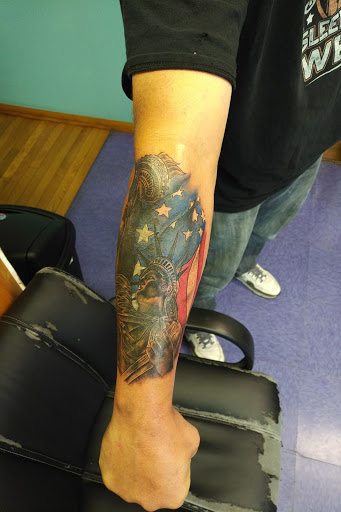 Explore male bicep tattoo ideas, creative tattoo ideas in Lima, available at White Wizard Tattoo & Body Piercing