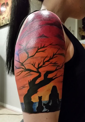 Explore women's arm sleeve tattoo ideas, creative tattoo ideas in Overland Park, available at Aftershock Tattoo Co.