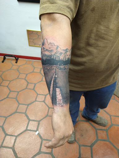 Explore tomahawk tattoo ideas, creative tattoo ideas in Wharton, available at Flawless Ink Tattoos