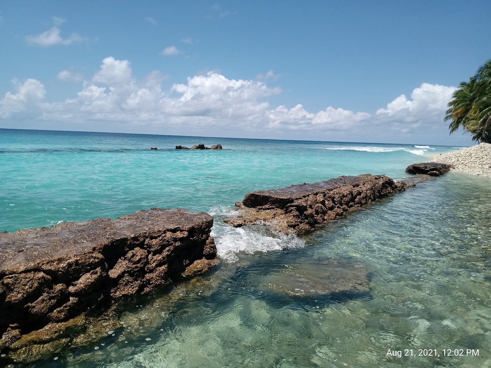 Foto van Rasgefannu Athiri Beach met turquoise puur water oppervlakte