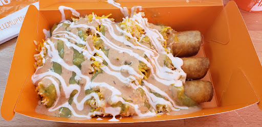 Avocado flour tortilla taquitos with cheese, sour cream and guac sauce.