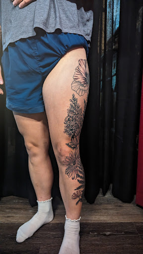 Explore foot tattoo ideas for men, creative tattoo ideas in Rochester, available at Axe of Kindness Tattoo