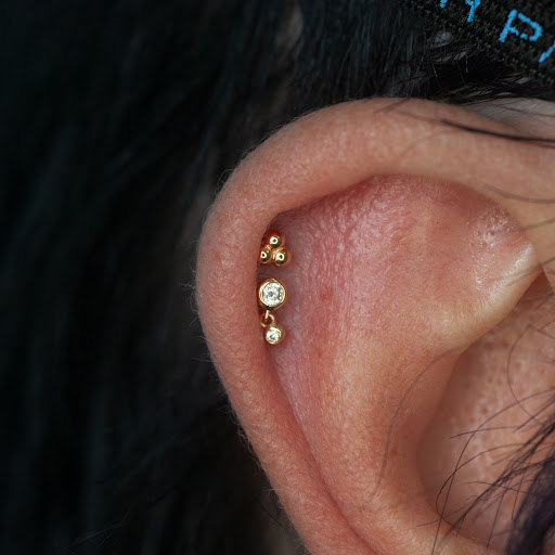 Explore simple silver lining tattoo ideas, creative tattoo ideas in Boston, available at Arcadia Body Piercing