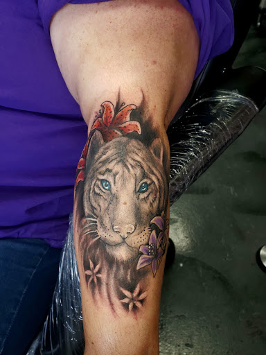 Explore dragon tattoo ideas for guys, creative tattoo ideas in Iowa Falls, available at BiPolar Studios