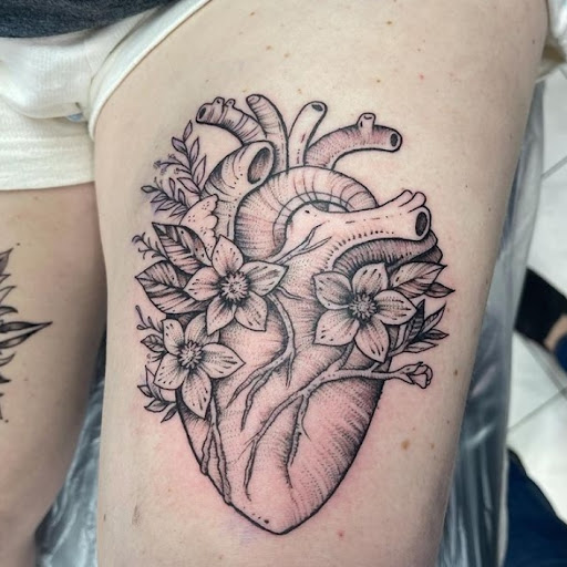 Explore heart with wings tattoo ideas, creative tattoo ideas in Schaumburg, available at Atmosphere Tattoo Gallery - Schaumburg