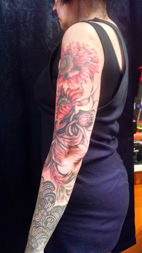 Explore feminine arm tattoo ideas, creative tattoo ideas in Greenfield, available at Pygmalions Tattoo
