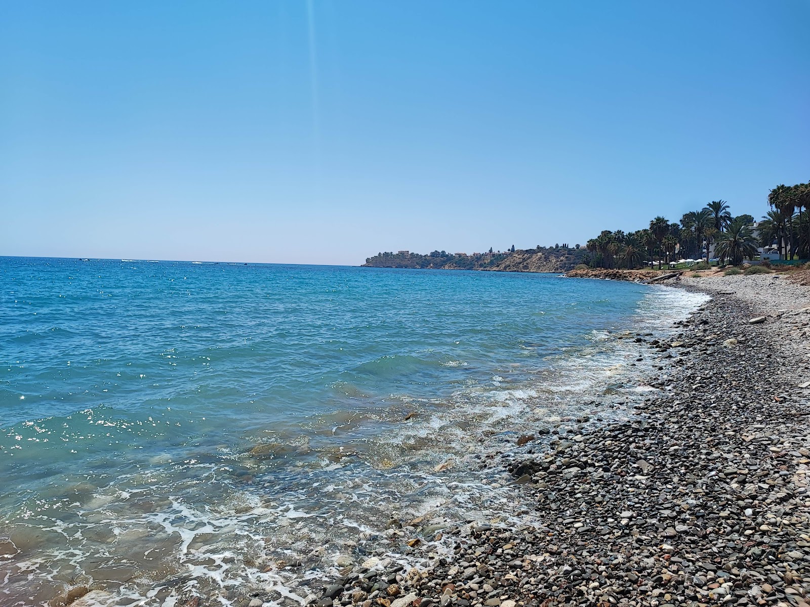 Foto di Coral Bay con una costa spaziosa