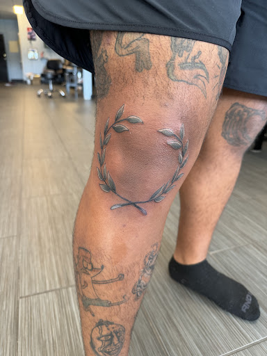 Explore male leg tattoo ideas, creative tattoo ideas in Palm Harbor, available at Angry Owl Tattoo and Piercing