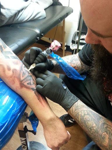 Explore rolling stones tattoo ideas, creative tattoo ideas in Spencer, available at Ink Envy Tattoo And Body Piercing