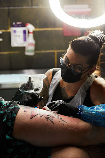 Find boob tattoo ideas for females for your next unique tattoo in Yucca Valley at Strata Tattoo Lab LLC