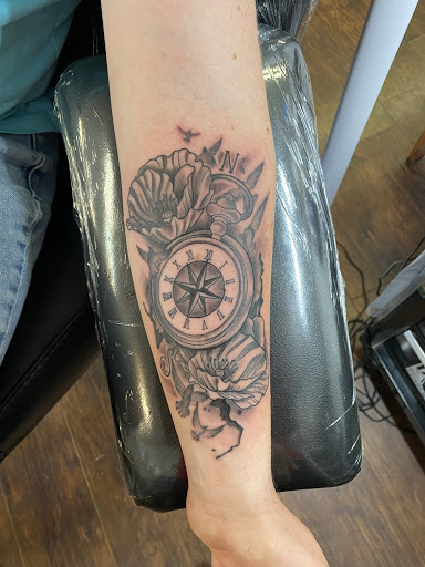 Explore dog bone tattoo ideas, creative tattoo ideas in Tacoma, available at Garfield Street Tattoo Co