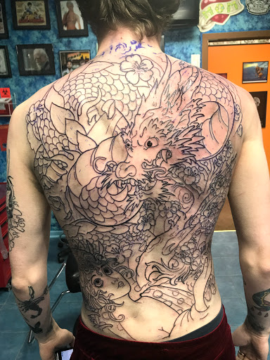 Explore deer skull tattoo ideas, creative tattoo ideas in Aurora, available at Ronin Tattoo Studio INC