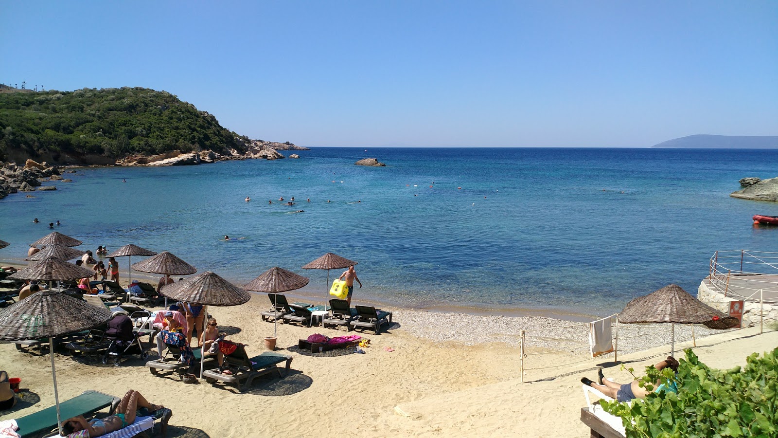 Foto de Teos Beach con arena beige superficie