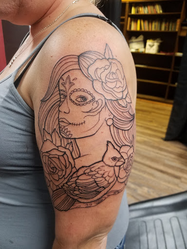Explore scuba diver tattoo ideas, creative tattoo ideas in Macomb, available at Lincoln Tattoo
