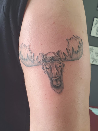 Explore book dragon tattoo ideas, creative tattoo ideas in Powell, available at Tattoo Saga