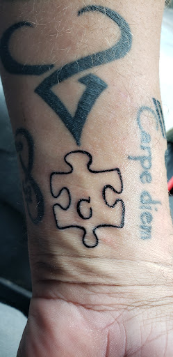 Explore ripped skin tattoo ideas, creative tattoo ideas in Warren, available at Tattoo X