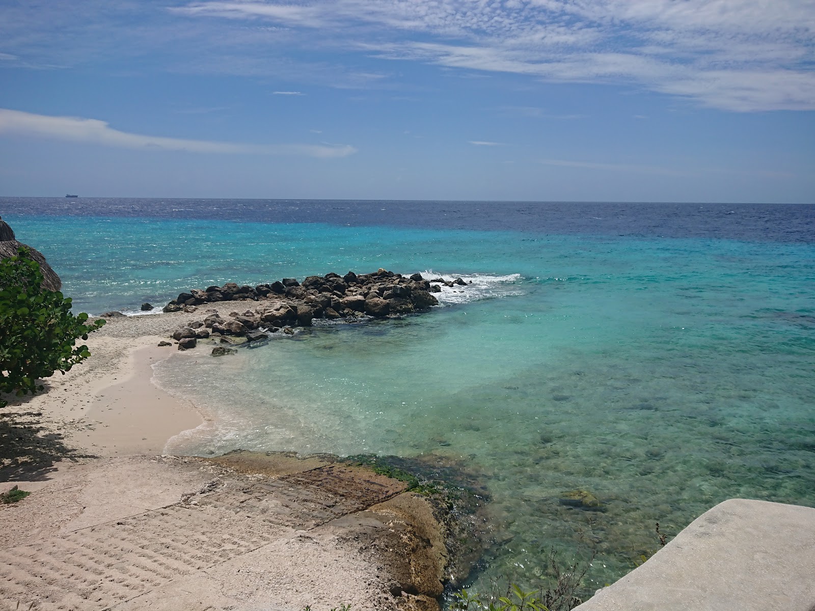 Foto de Playa Wachi con arena brillante superficie