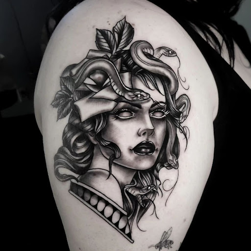 Explore simple silver lining tattoo ideas, creative tattoo ideas in Calhoun, available at A Sailors Grave Tattoo Parlor