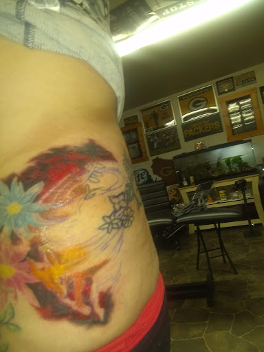 Explore swimming tattoo ideas, creative tattoo ideas in Stetsonville, available at Solace Ink Company LLC