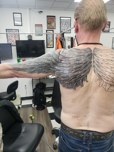 Explore gap filler tattoo background shading ideas, creative tattoo ideas in Green Bay, available at Sonic Tattoos