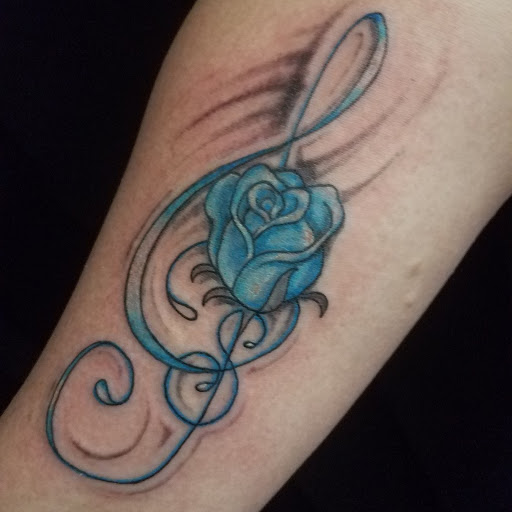 Find in between breast tattoo ideas for your next unique tattoo in Bowling Green at The Mad Tatter, L.L.C.