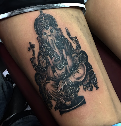 Explore rip neck tattoo ideas, creative tattoo ideas in Rochester, available at The Ink Cartel Tattoo