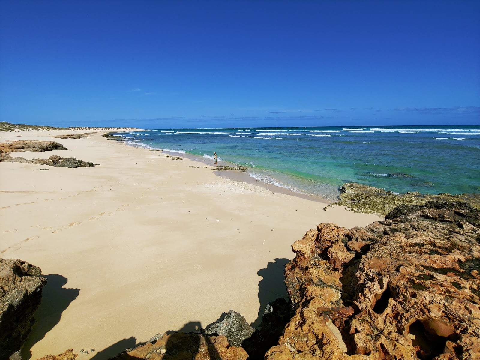 Jims Beach的照片 带有明亮的沙子表面