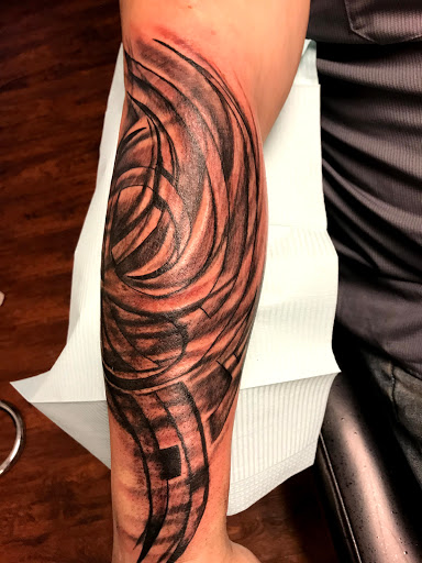 Explore head tattoo ideas for guys, creative tattoo ideas in Seymour, available at American Gypsy Tattoo Corp.