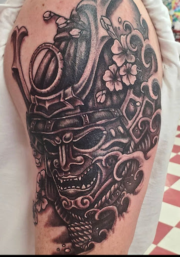 Explore dripping tattoo ideas, creative tattoo ideas in Mchenry, available at Lunchbox Tattoo and Body Piercing