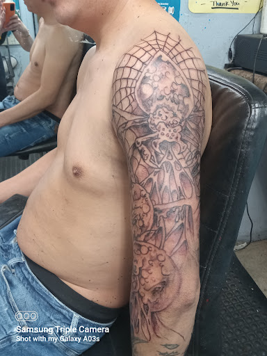 Explore small chest tattoo ideas for men, creative tattoo ideas in Cranston, available at Kabloom Tattoo Studio