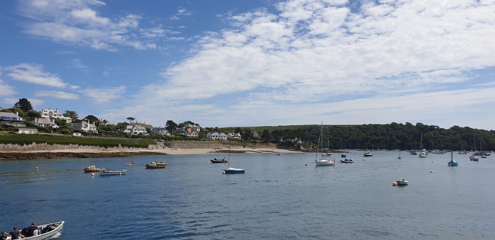 Photo of St Mawes beach surrounded by mountains