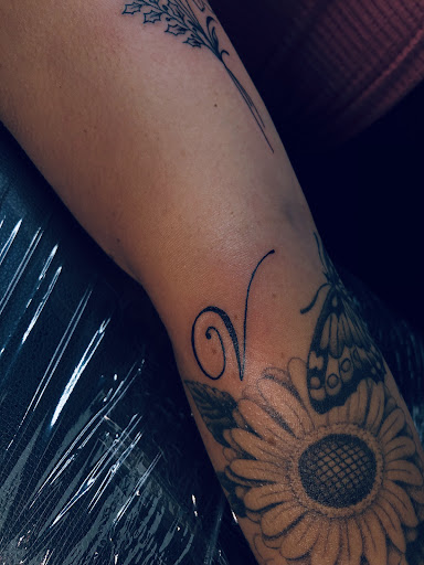 Explore feminine neck tattoo ideas, creative tattoo ideas in North Tonawanda, available at Dark Side Ink Tattoo Studio