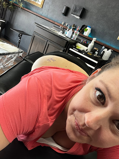 Explore tramp stamp tattoo ideas, creative tattoo ideas in Aurora, available at Aurora Tattoo Company