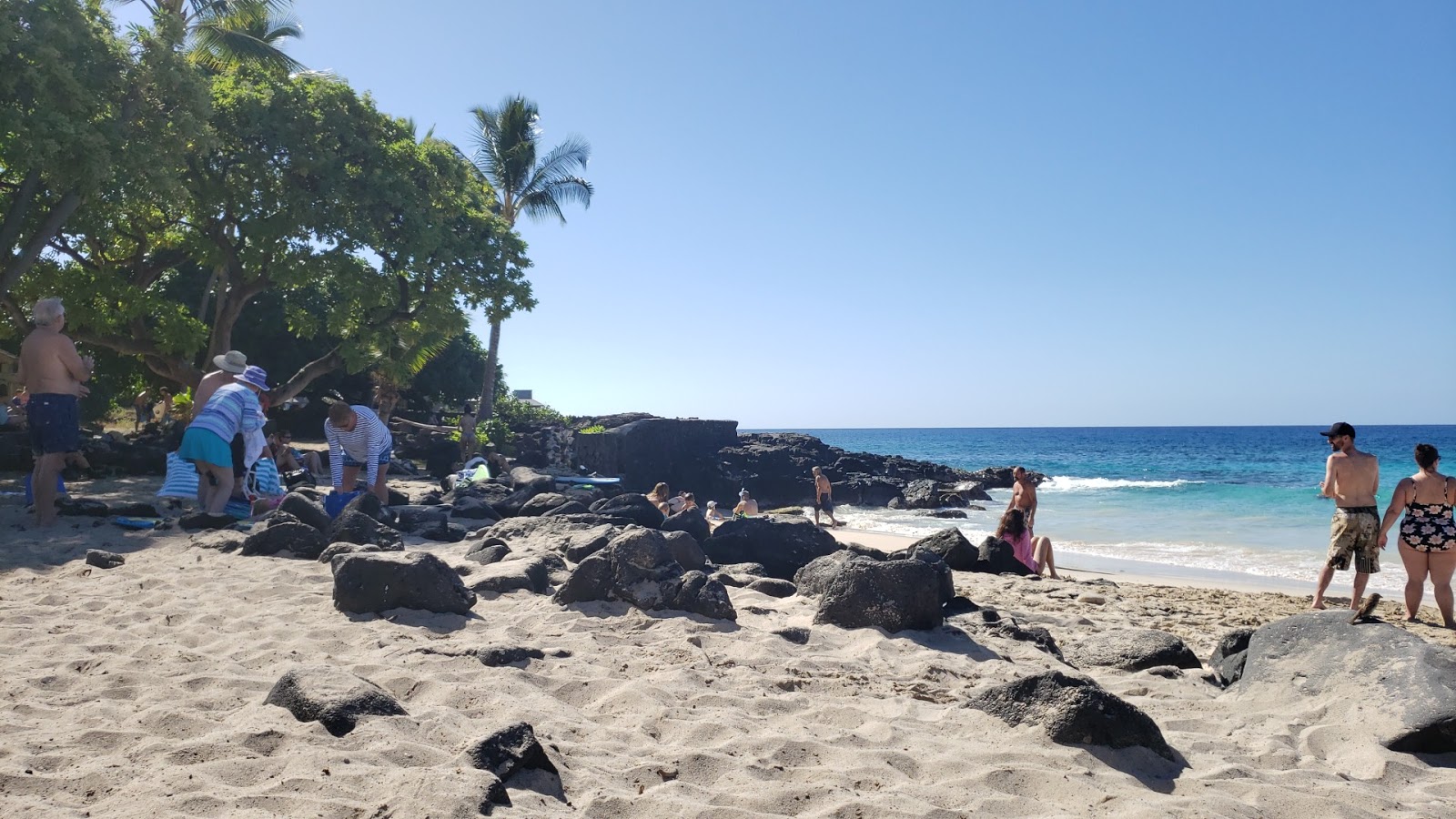 Photo of Laupāhoehoe Beach with gray sand &  rocks surface