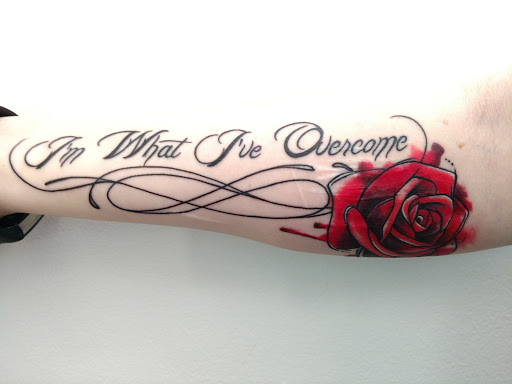 Explore cross tattoo ideas for females, creative tattoo ideas in Kingston, available at Stinky Monkey Tattoos