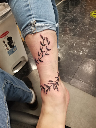 Find necklace tattoo ideas for your next unique tattoo in Rogers at Saved by Grace Tattoo Studio