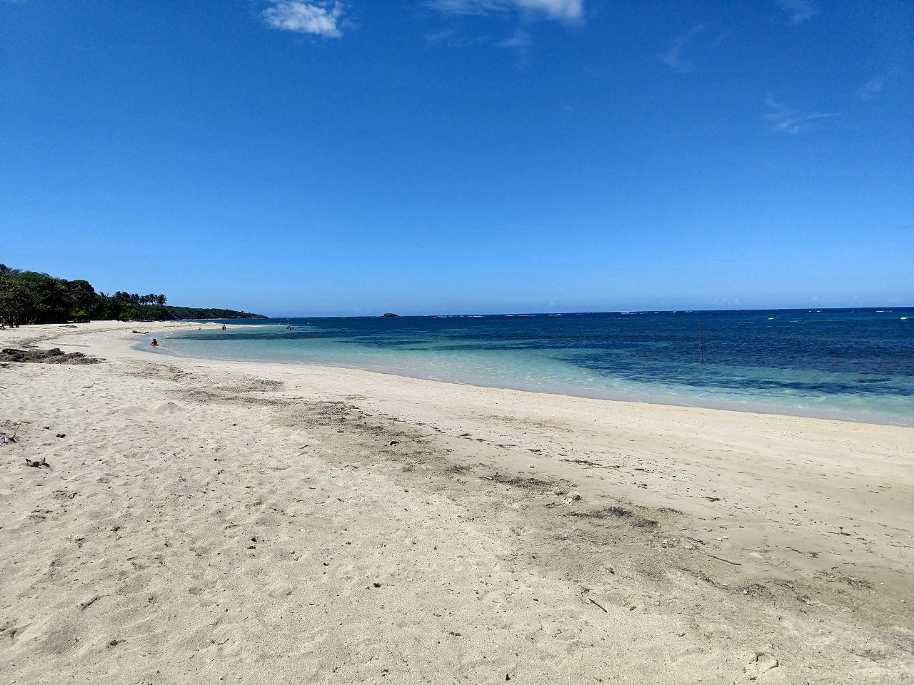 Fotografija Playa Teco Maimon z svetel pesek površino