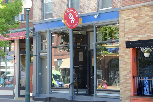 Omega Red Piercing & Tattoo