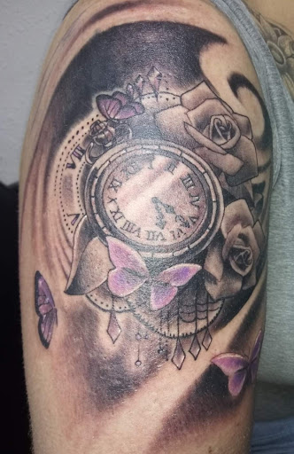 Explore shoulder arm tattoo ideas, creative tattoo ideas in Angola, available at Hoodlum Ink